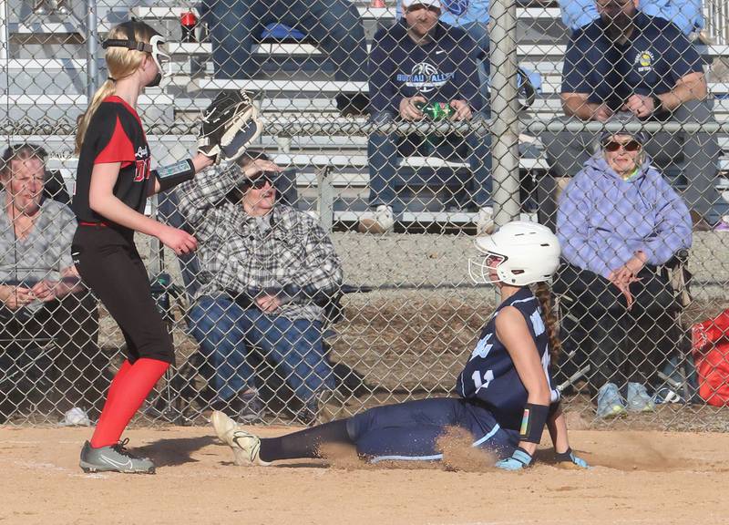 Bureau Valley's Danicka Benavidez slides safe into home plate as Hall's Madison Krewer waits for the late throw on Monday, March 9, 2026 at Bureau Valley High School.