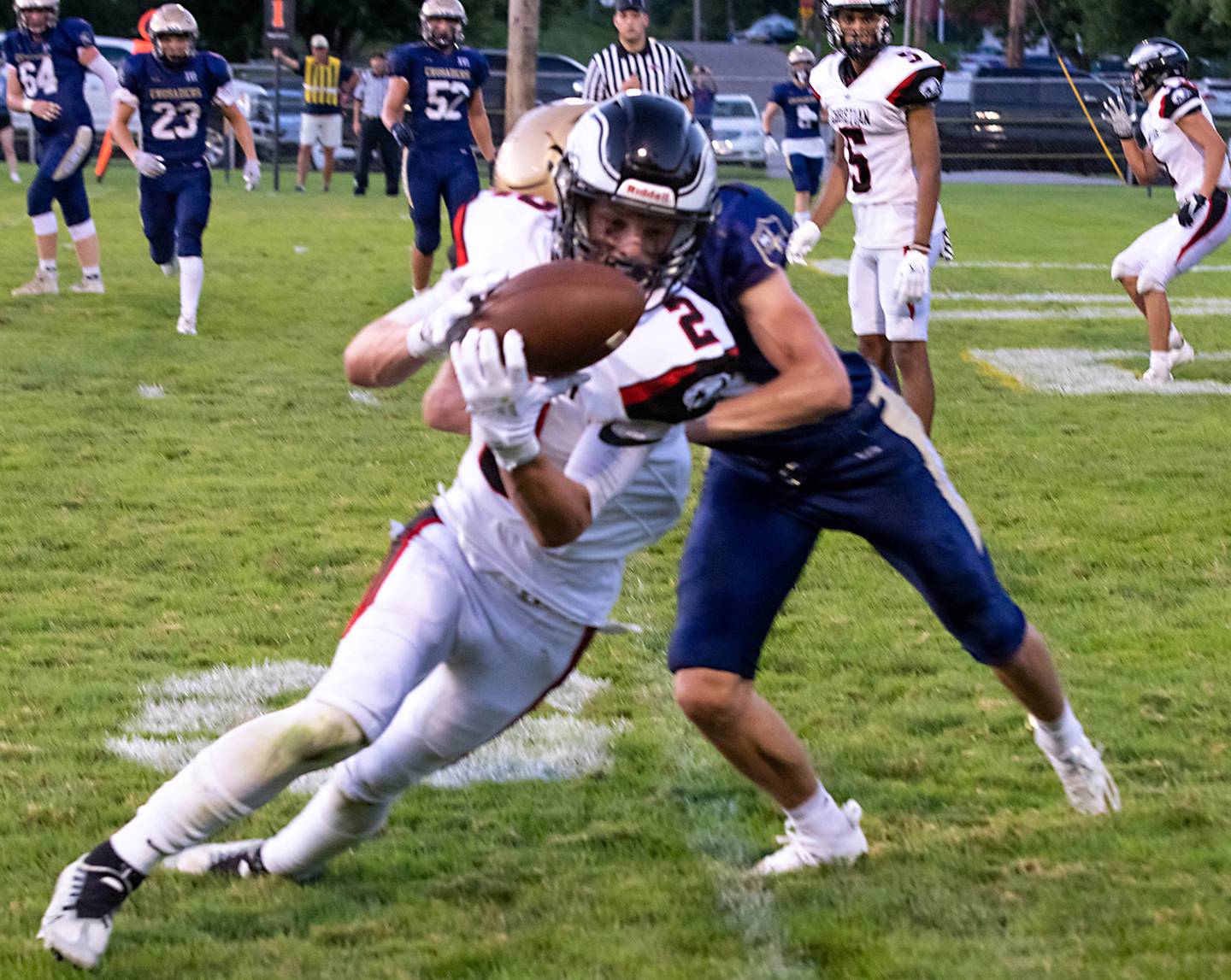 Marquette's Caden Eller (33) brings down Aurora Christian's Owen Hampton (2) during a failed two-point conversion in the second quarter on Friday Aug. 26, 2022 at Gould Stadium in Ottawa.