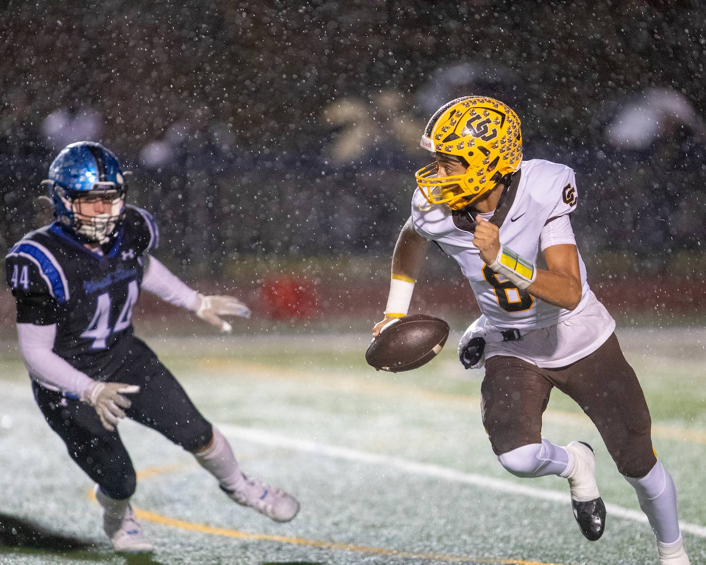 Carmel's Trae Taylor runs the ball against St. Charles North at the Class 7A Second Round playoff game on Saturday, Nov.8,2025 in St. Charles.