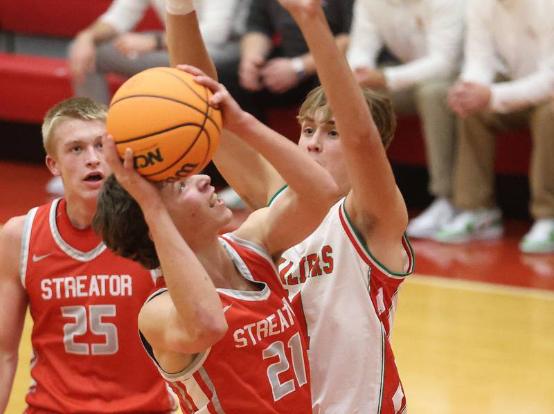 Streator's Brennen Stillwell eyes the hoop as L-P's Jameson Hill defends during the Dean Riley Shootin' The Rock Thanksgiving Tournament on Monday Nov. 24, 2025 in Kingman Gymnasium at Ottawa High School.