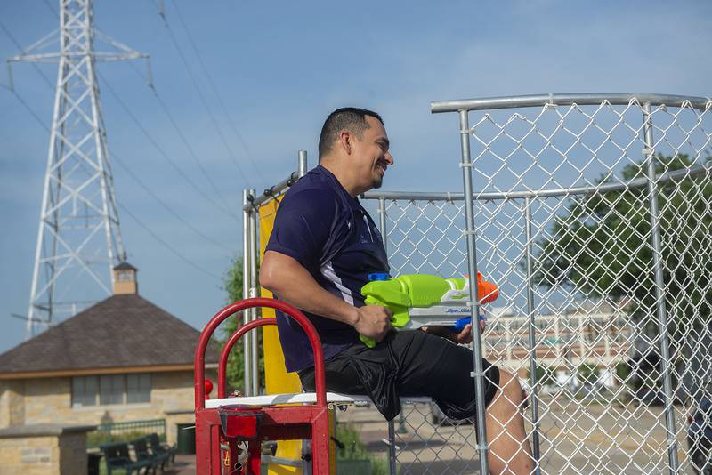 Dixon mayor Li Arellano waits his turn atop the dunk tank Wednesday, June 15, 2022 at the Dixon riverfront market. The market shut down early due to high winds creating havoc for the vendors.