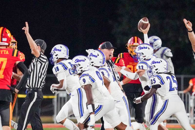 St. Charles North's Luke Epstein (32) celebrates with his team after recovering a fumble against Batavia during a football game at Batavia High School on Friday, Sep 20, 2024.