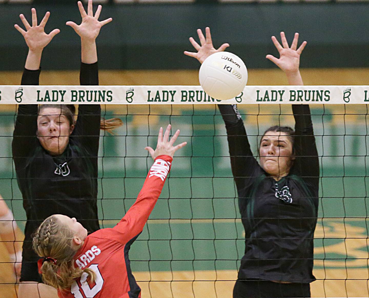 Henry-Senachwine's Abbie Stanbary (10) has her kill blocked by St. Bede's Ali Bosnich (23) in the Class 1A semifinal game on Wednesday, Oct. 16, 2022 at St. Bede Academy in Peru.