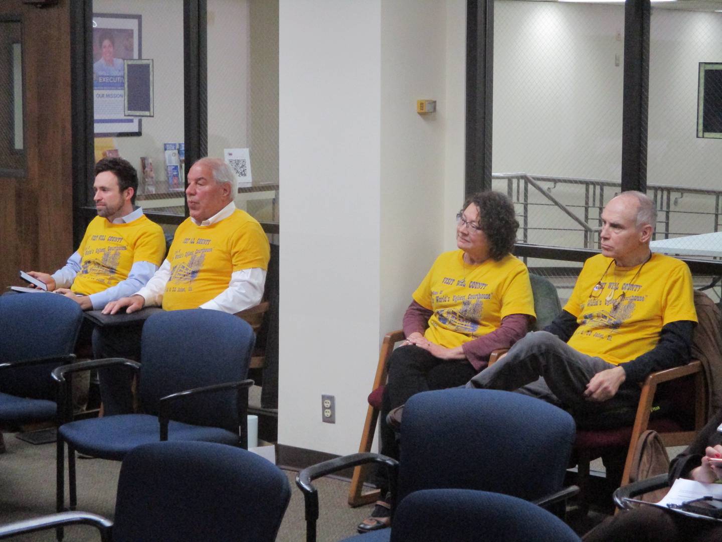 Advocates for preserving the old Will County Courthouse, including (from left) County Courthouse Partnership co-chairs Hudson Hollister and Nick Macris, listen to discussion at the Will County Board meeting on Thursday, March 16, 2023.