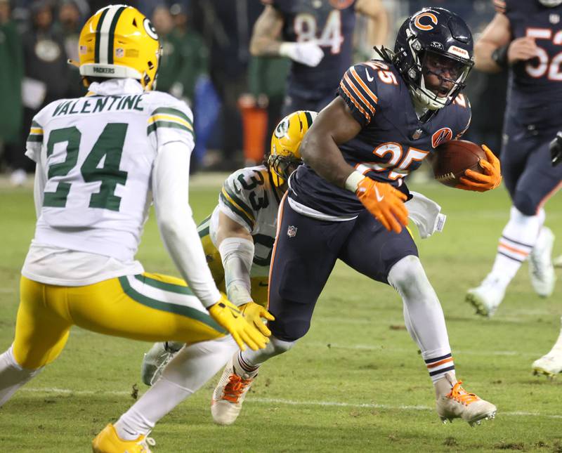 Chicago Bears running back Kyle Monangai looks to get by Green Bay Packers cornerback Carrington Valentine during their NFL Wild Card game Saturday, Jan. 10, 2026, at Soldier Field in Chicago.