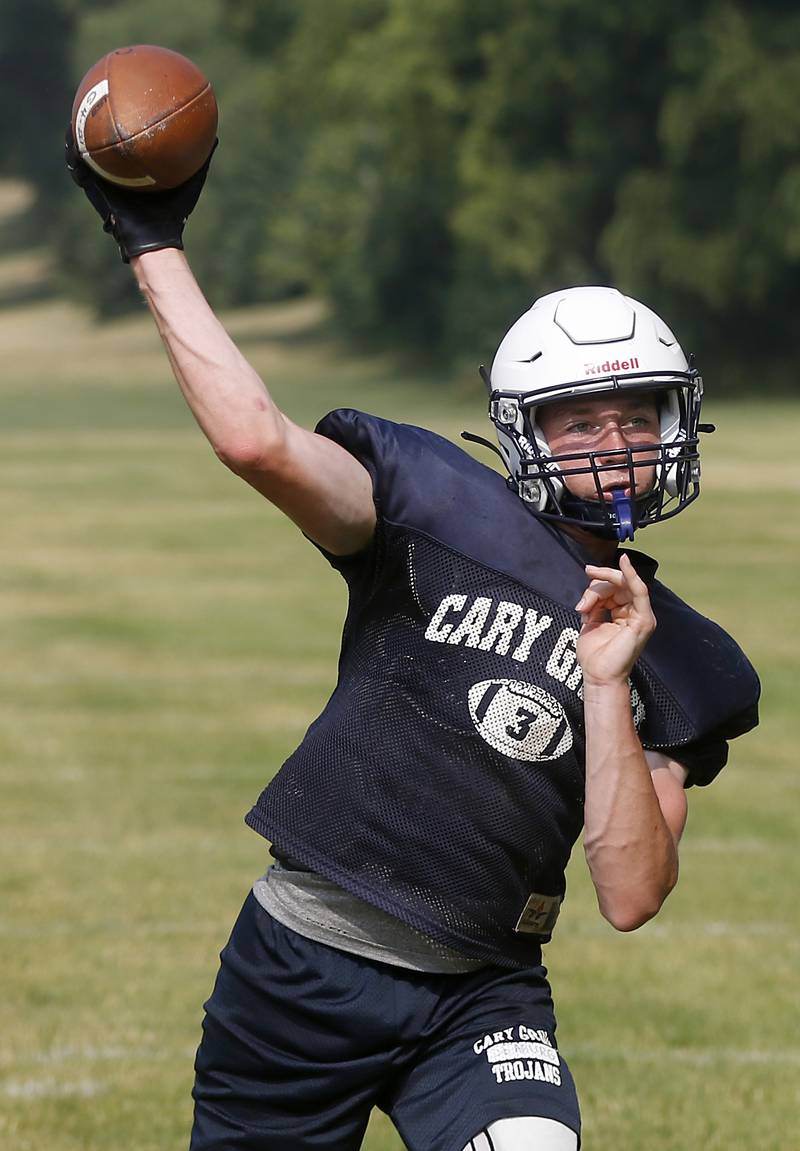Cary-Grove’s Peyton Seaburg throws a pass during football practice Thursday, June 29, 2022, at Cary-Grove High School in Cary.