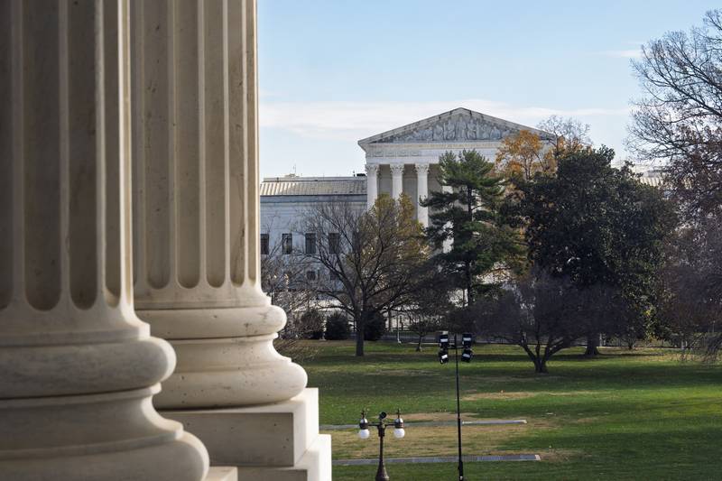 FILE - The Supreme Court is framed by the columns of the Capitol in Washington, Dec. 3, 2024.  (AP Photo/J. Scott Applewhite, File)