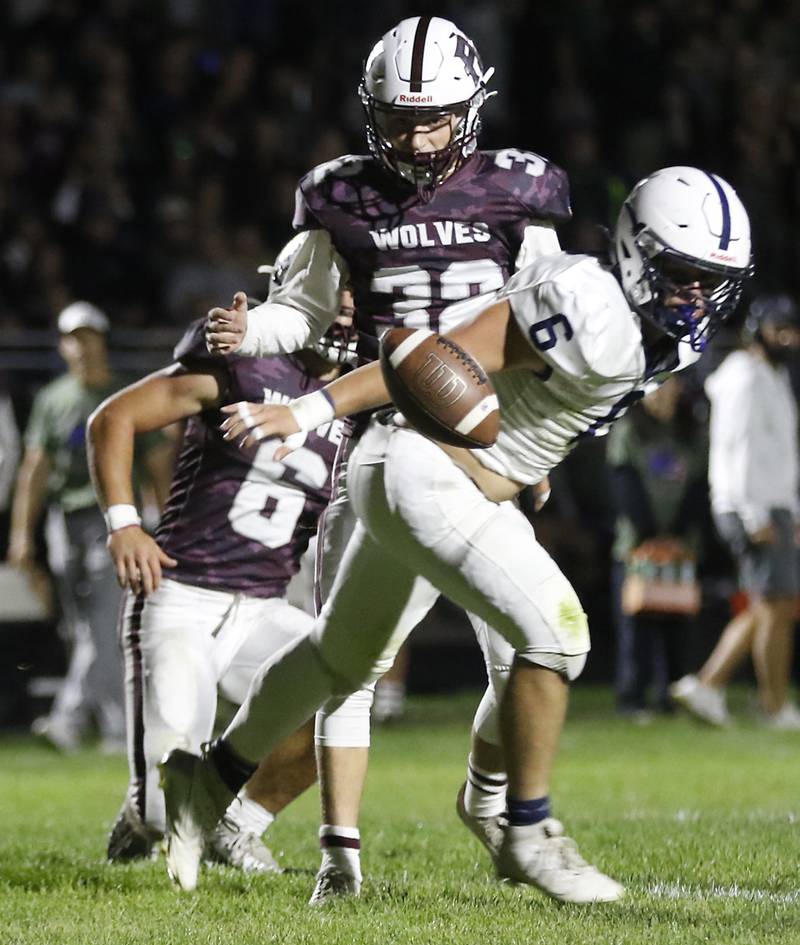 Cary-Grove's Charles Ciske tries to grab the football after he blocked Prairie Ridge's Chase Santucci’s extra point during a Fox Valley Conference football game on Friday, Sept. 27, 2024, at Prairie Ridge High School.