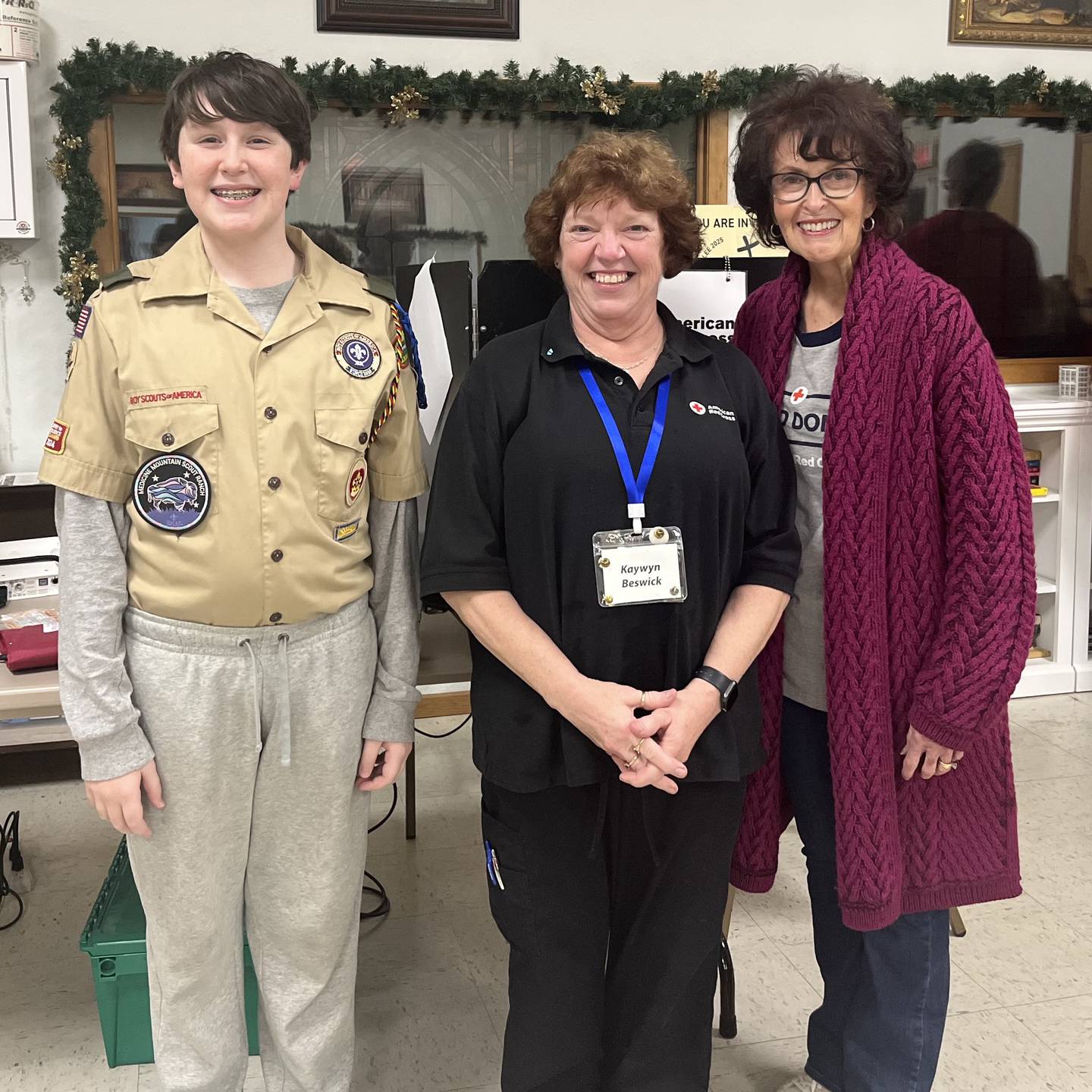 Boy Scout Isaac Blevins (left) earned a medical/health badge by escorting donors at the Morrison American Red Cross blood drive. He is pictured with his grandmother, Stephanie Vavra (right), who topped off her 10-gallon milestone at the drive, and Kaywyn Beswick, Morrison ARC Blood Program leader.