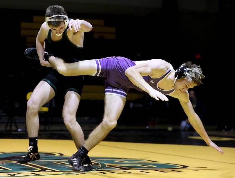 Crystal Lake South’s Aiden Marrello takes down Hampshire’s John Janicki during the 165-pound match of a Fox Valley Conference wrestling meet on Thursday, Jan. 15, 2026, at Crystal Lake South High School.