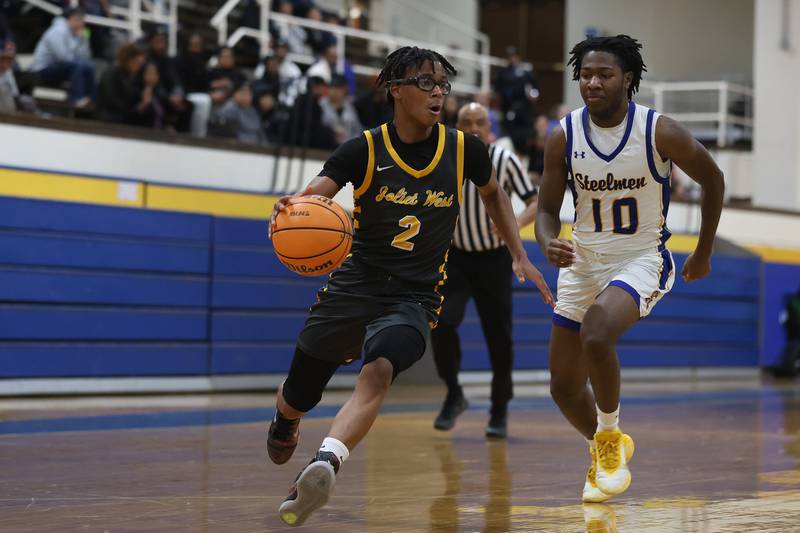 Joliet West’s Elijah Wilson looks to make a play against Joliet Central on Thursday, Jan. 15, 2026 in Joliet.