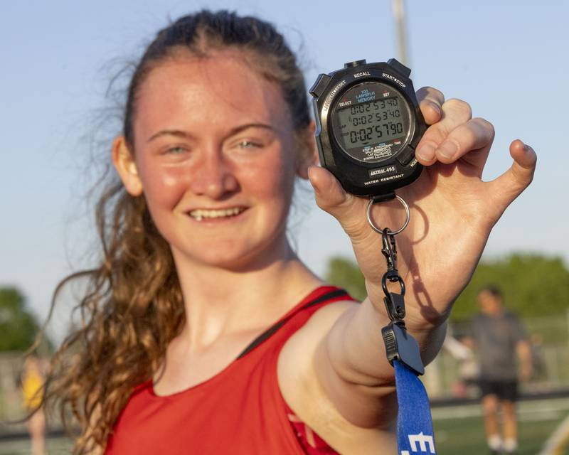 Jadelyn Wangelin of Hall High School celebrates a first place in her heat and a new personal best time of 2:53:40 during the girls 800 meter heat race at Mendota High School on May 3, 2023.