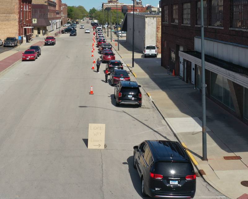A long line of cars stretch all the way back to 2nd and Wright Stret for the 27th annual Lighted Way Spaghetti Dinner on Monday, April 20. 2025 downtown La Salle.