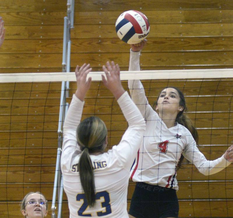 Streator’s Sonia Proksa prepares to tip the ball past Sterling’s Sienna Stingley during the first match Tuesday at Streator.