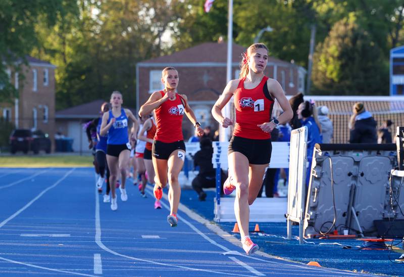 Lincoln-Way Central's Mia Forystek leads teammate Katie Petrosky in the 800-meter race during the IHSA Class 3A Chicago Heights Girls Track and Field Sectional at Bloom High School on Wednesday, May 13, 2026.
