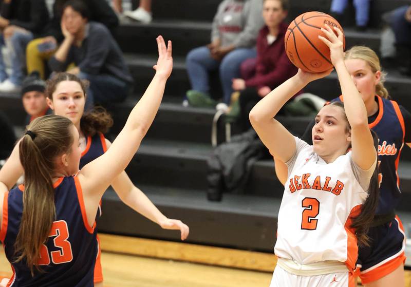 DeKalb’s Ella Medina shoots over Naperville North's Ema Gilvydis Monday, Jan. 22, 2024, during their game at DeKalb High School.