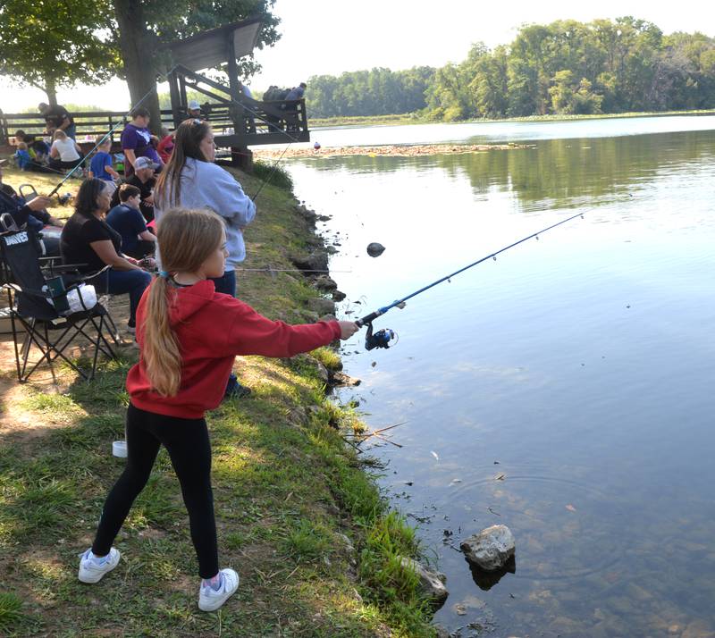 Mena Appleman, 11, of Morrison, casts her line into Lake Carlton during the Whiteside County Sheriff Office and Mounted Patrol's annual fishing derby at Morrison-Rockwood State Park in Morrison on Saturday, Sept. 9, 2023.