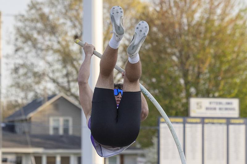 Dixon’s Tuckker Tarner starts his ascent in the pole vault Thursday, April 25, 2024 at the Sterling High School Night Relays.