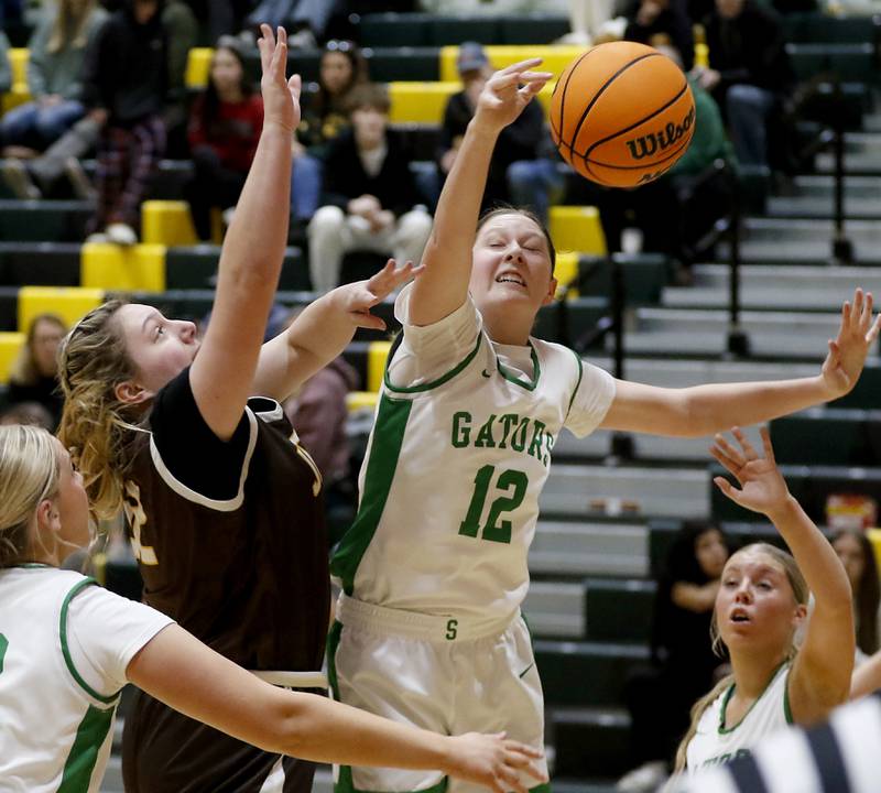 Crystal Lake South's Laken Lepage (right) blocks the shot of Jacobs' Olivia Schuldt during a Fox Valley Conference basketball game on Friday, Jan. 17, 2025, at Crystal Lake South High School.
