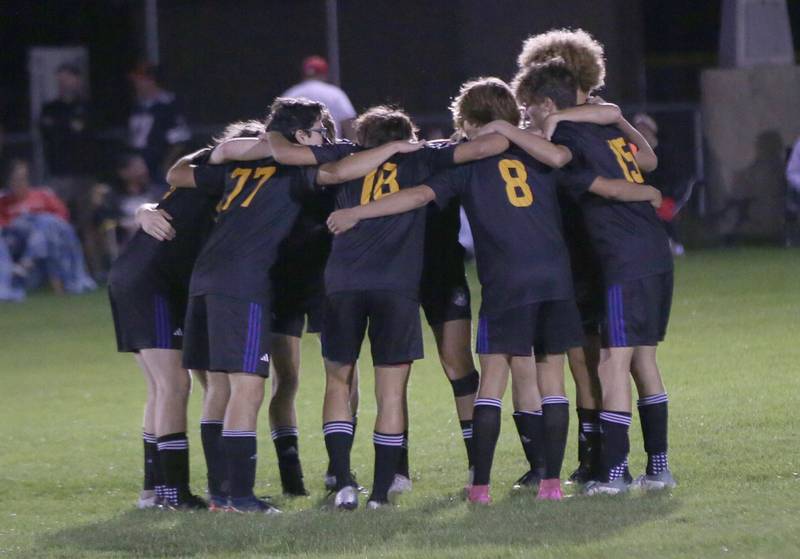 Members of the Somonauk soccer team huddle before playing Earlville in the Little Ten Conference championship game on Thursday, Oct. 5,  2023 at Hinckley High School.