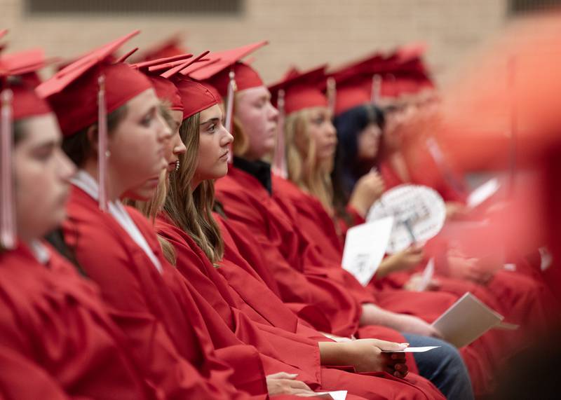 Olivia Evola sits with her other 300 classmates Friday, May 24, 2024, during Ottawa High School's graduation ceremony in Kingman Gym.
