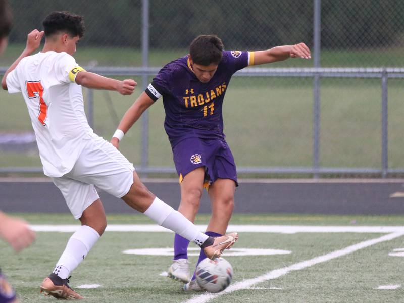 Mendota's Izaiah Nanez kicks the ball to the keeper as Winnebago's Brandon Armenta defends on Wednesday, Oct. 4, 2023 at Mendota High School.