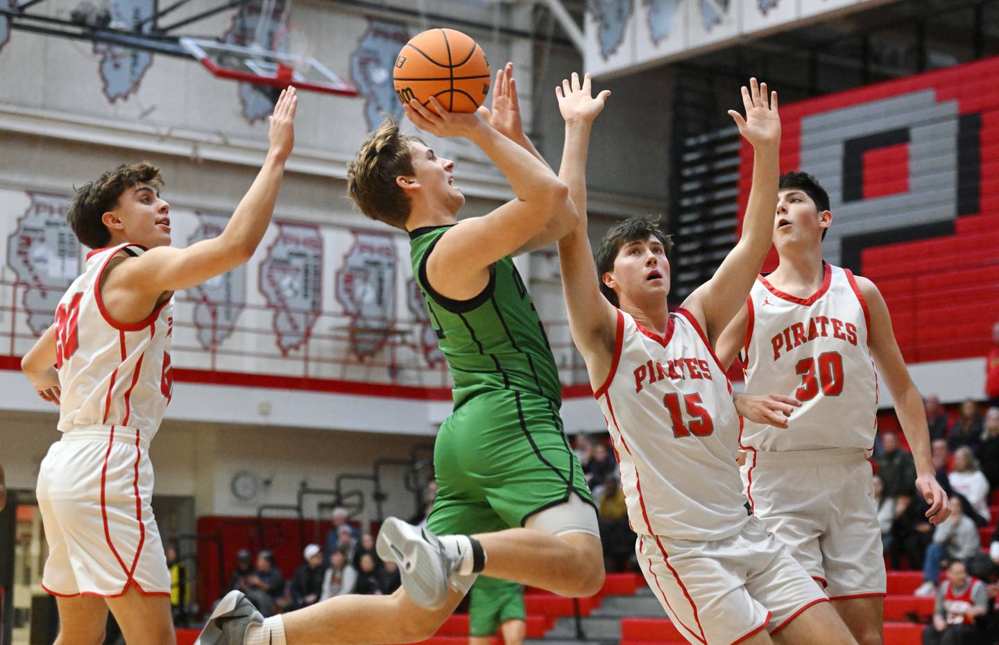 York's Gabe Piper makes a move to the basket against Palatine defenders including, from left, Andy Iliopoulos, Kasey May and Brady May during the Palatine boys basketball tournament on Friday, Nov. 29, 2024 in Palatine.