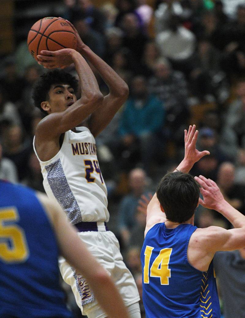 John Starks/jstarks@dailyherald.com
Rolling Meadow’s Cameron Christie shoots over Lyon’s Connor Carroll in the Jack Tosh boys basketball tournament at York High School in Elmhurst on Friday, December 30, 2022.