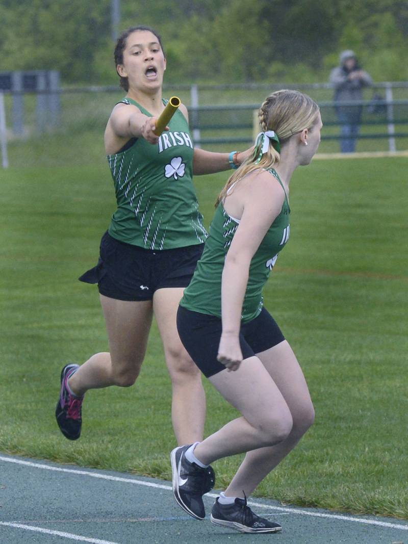 Seneca’s Anna Bruno hands off to team mate Natalie Misner in the 4x800 relay during Thursday’s girls sectional at Seneca.