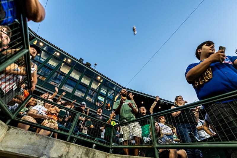 Fans cheer for hot dogs following the Wiener Drop World Record Attempt, sponsored by Pabst Light, at Duly Heath and Care Field on July 22, 2025.