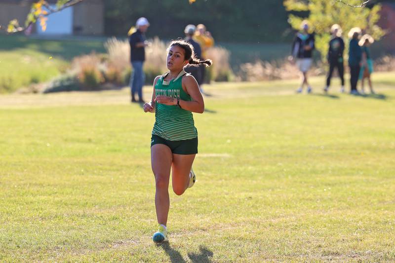 Bishop McNamara's Ana Franceschini nears the finish line in the girls 3-mile race during All-Area Cross Country meet on Wednesday, Oct. 8, 2025, at Kankakee Community College.
