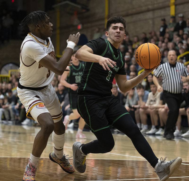 Rock Falls’ Austin Castaneda handles the ball against Christ the King’s Mike Thomas Monday, March 10, 2025, during the Class 2A boys basketball Supersectional in Sterling.