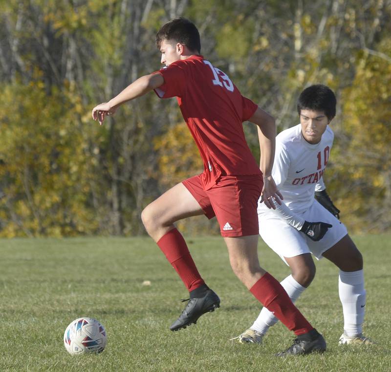 Streator’s Aaron Henson gets past Ottawa’s Michael Bedolla in the 1st half Tuesday at Streator.