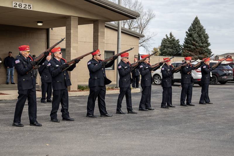 The Abraham Lincoln National Cemetery Memorial Squad participates in a rifle salute during a Veterans Day ceremony at American Legion Post 1080 in Joliet on Nov. 11, 2025.