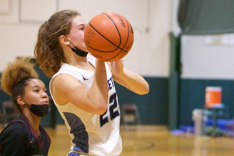 Nazareth Academy's Grace Carstensen puts the shot up against Peoria Central