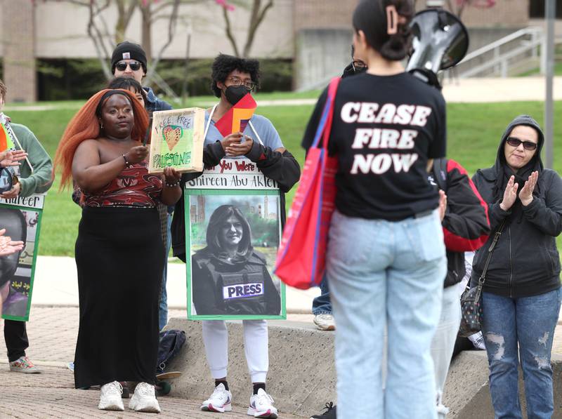 A group of about twenty demonstrators held signs and chanted in the MLK Commons at Northern Illinois University Monday, April 29, 2024, to protest the Israel-Hamas War.