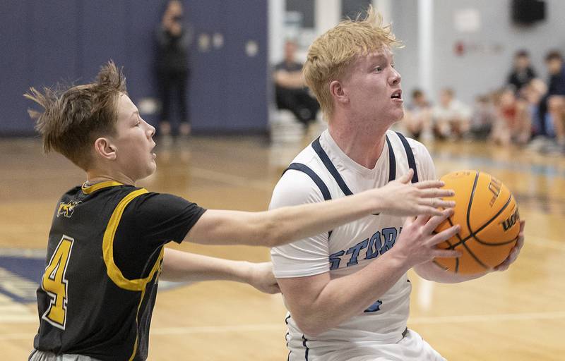 Bureau Valley’s Bryce Helms looks to pass while being defended by Riverdale’s Paxton Kiddoo Wednesday, Feb. 26, 2025, at the Class 2A Regional semifinal at Bureau Valley High School.