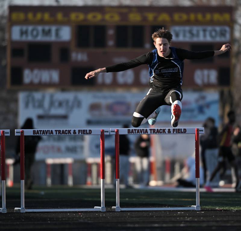St. Charles North’s Austin Fraser clears the last hurdle in his heat of the 300-meter hurdles at the Les Hodge Boys Track and Field Invitational at Batavia High School on Friday, April 5, 2024.