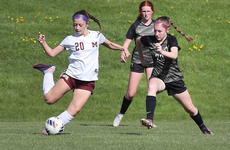 Sycamore's Izzie Segreti tries to keep the ball away from Morris' Nicolette Boelman during their Interstate 8 Conference Tournament semifinal game Wednesday, May 3, 2023, at Sycamore High School.