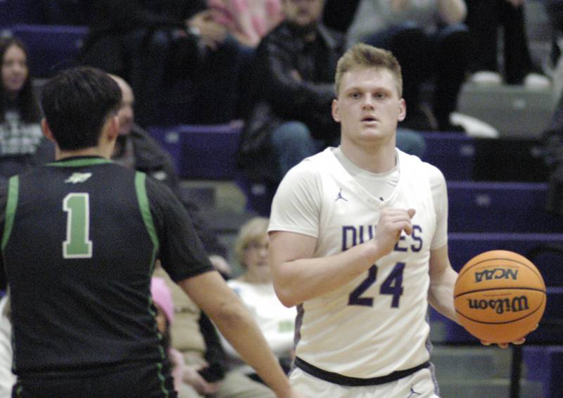 Dixon's Eli Davidson brings the ball up court. Dixon hosted Rock Falls in boys basketball Friday, February 14, 2025 at Lancaster Gym at Dixon High School. Rock Falls won a hard fought game 48-46.