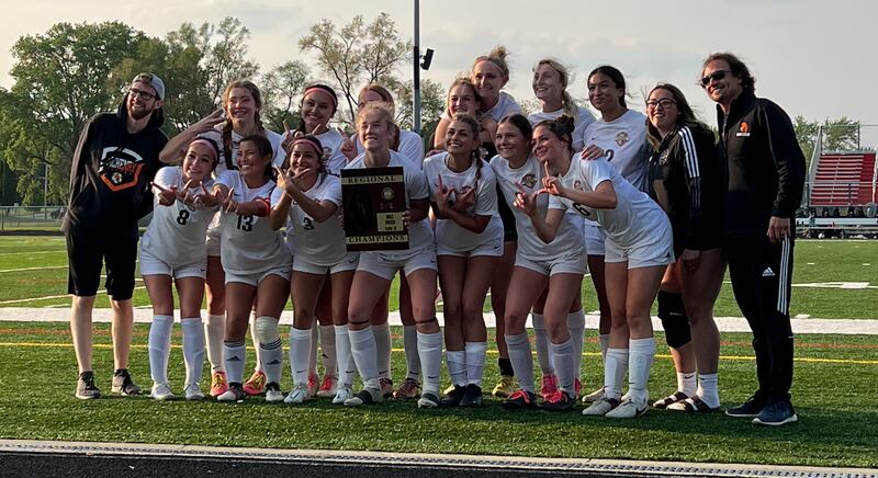McHenry's girls soccer team celebrates a 1-0 win over Jacobs in the Class 3A Grant Regional championship on Friday in Fox Lake.