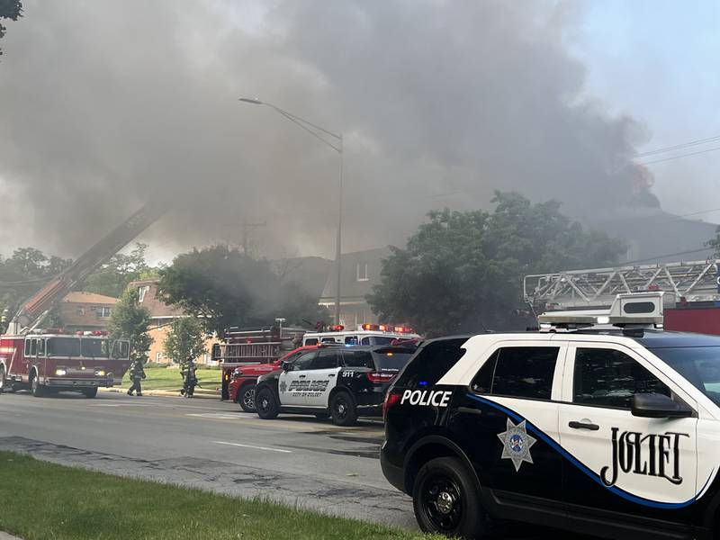 Joliet police and fire crews at the scene of an apartment building fire on Essington Road in Joliet on the morning, Tuesday, June, 10, 2025. The building is near Jefferson Street.