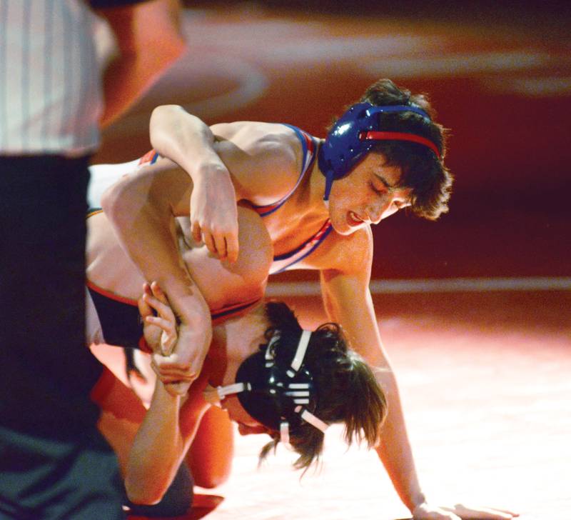 Oregon's Nelson Benesh (top) wrestles a Sandwich opponent during the 132-pound match at a triangular meet with Morrison on Friday, Jan. 31, 2025 in the Blackhawk Center at Oregon High School.