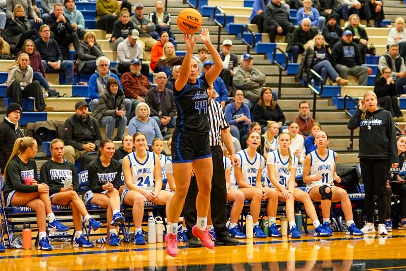 St. Charles North's Riley Barber (44) shoots a 3-pointer against Geneva during a game at Geneva High School on Thursday, Dec. 4, 2025.