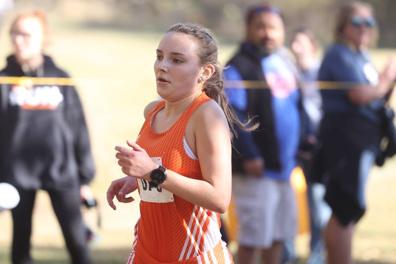 Oswego’s Audrey Sorderlind finishes first uncontested in the Girls Cross Country Class 3A Minooka Regional at Channahon Community Park on Saturday.