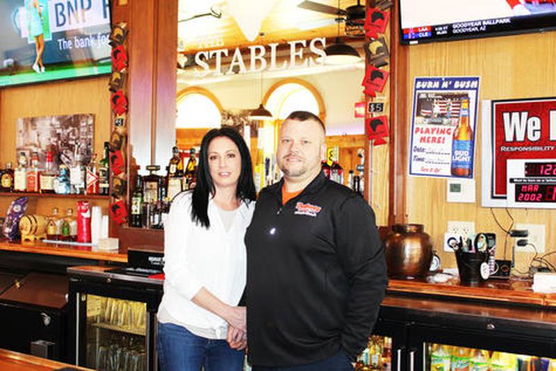 Jen Coley and Brian Dabney are partners in business and partners in life. They have a busy business portfolio with The Stables bar, Dabney Services truck repair and towing, and Dabney Trucking.
