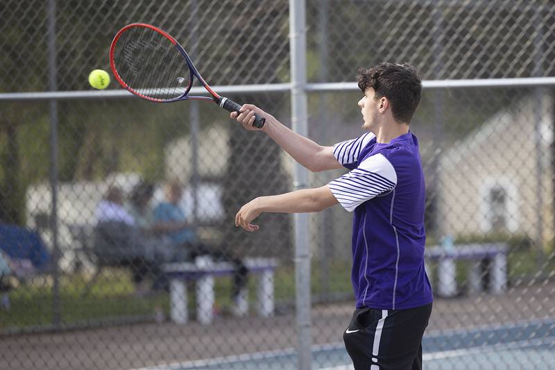 Dixon’s Damian Beck plays the ball against Newman’s Logan Palmer Tuesday, May 9, 2023.