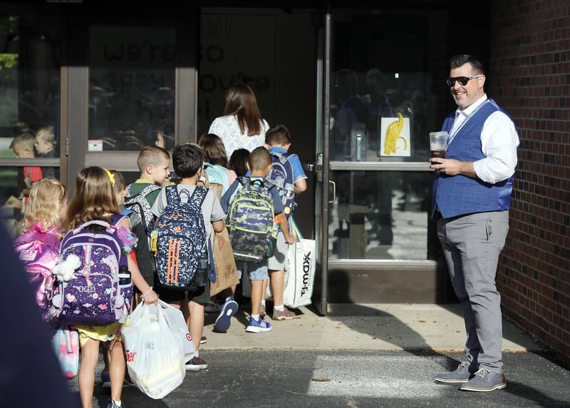 Geneva Unit District 304's new superintendent, Andy Barrett, greets students and teachers at Western Avenue Elementary School Wednesday August 16, 2023 in Geneva.