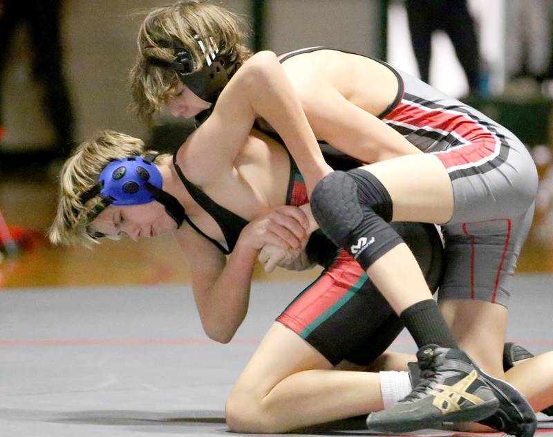 Ottawa's Dallas Harmon wrestles L-P's Franc Knap in the 113 weight match during a wrestling meet in Sellett Gymnasium on Wednesday Dec. 7, 2022 at L-P High School.