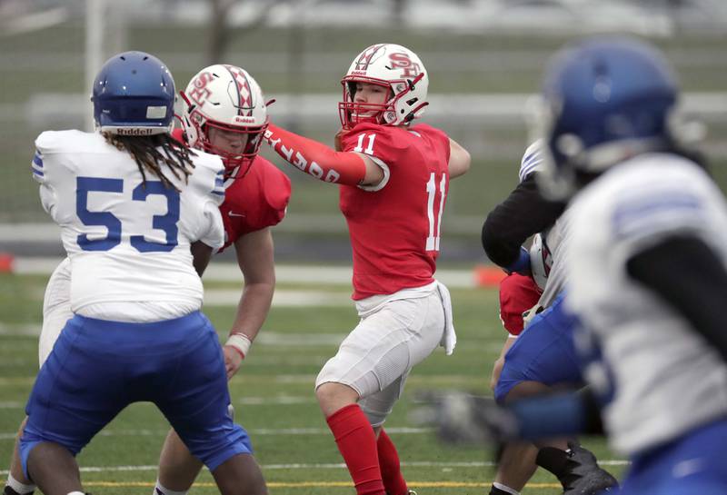 South Elgin's Ben Karpowicz (11) looks for an open teammate Saturday April 10, 2021 in Elgin.